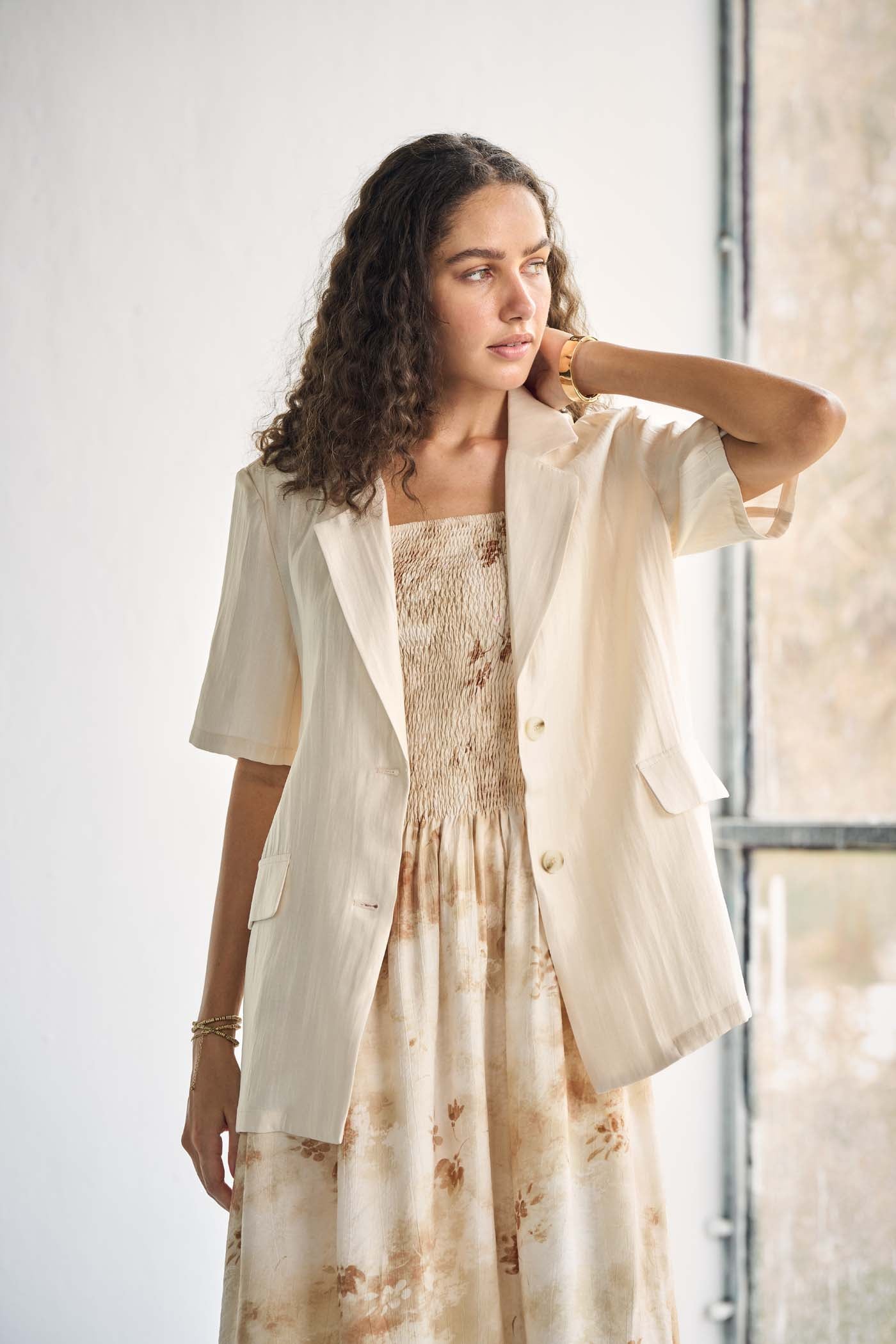 Ivory-tone blazer with notched lapels