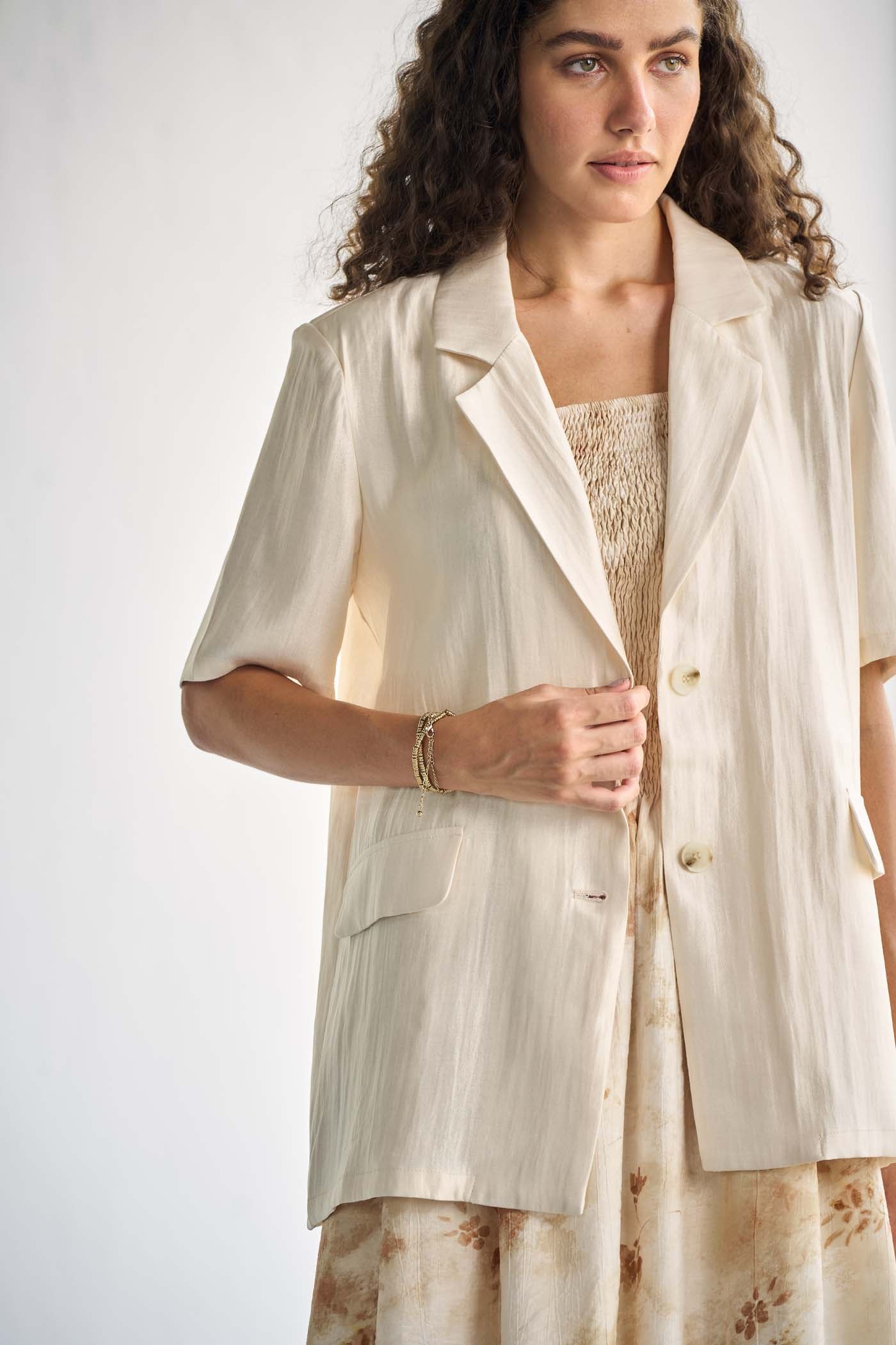 Ivory-tone blazer with notched lapels