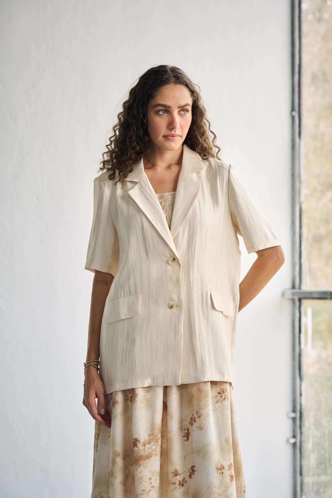 Ivory-tone blazer with notched lapels