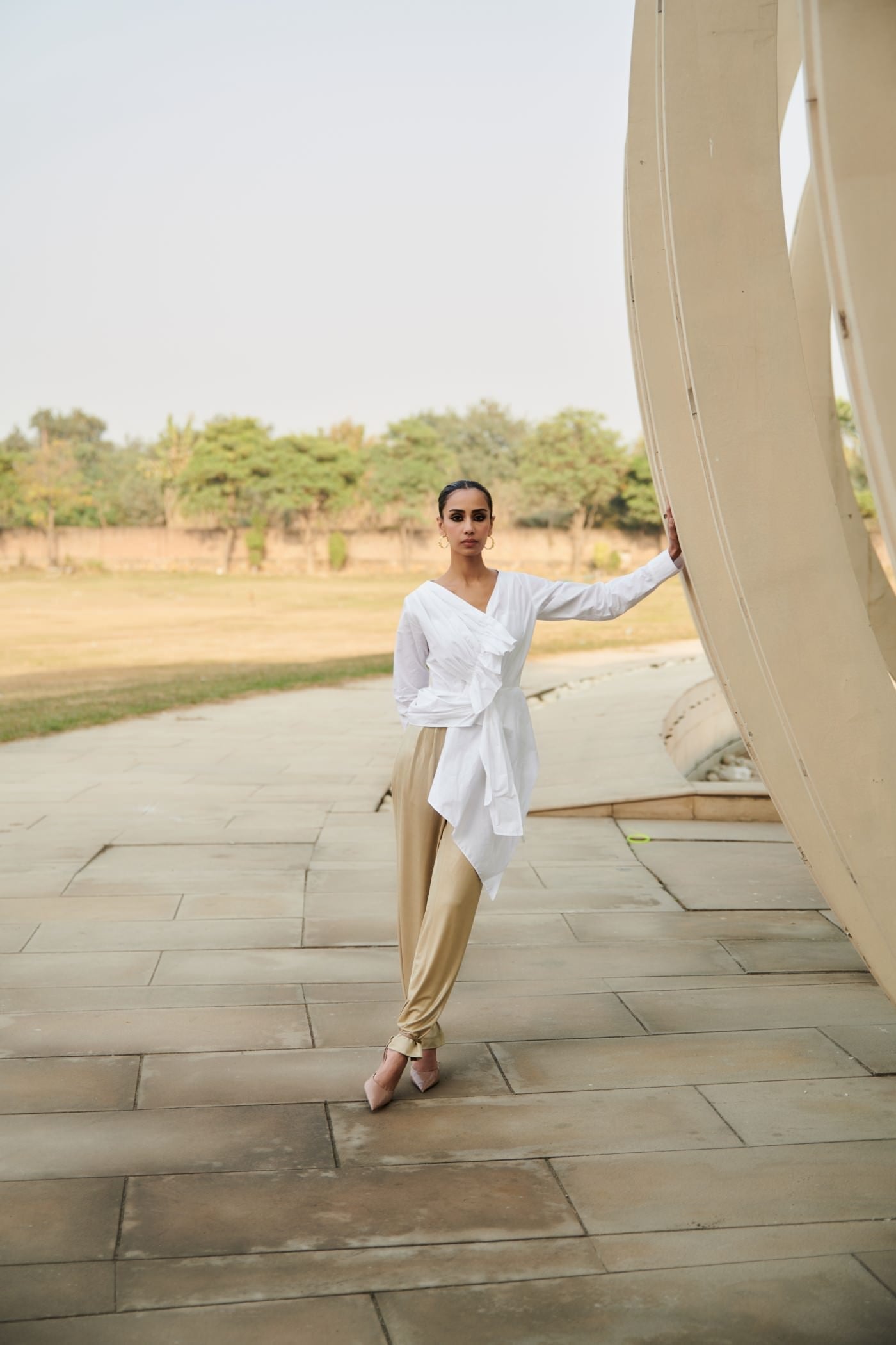 White Asymmetrical Draped Top With Golden Straight Pants