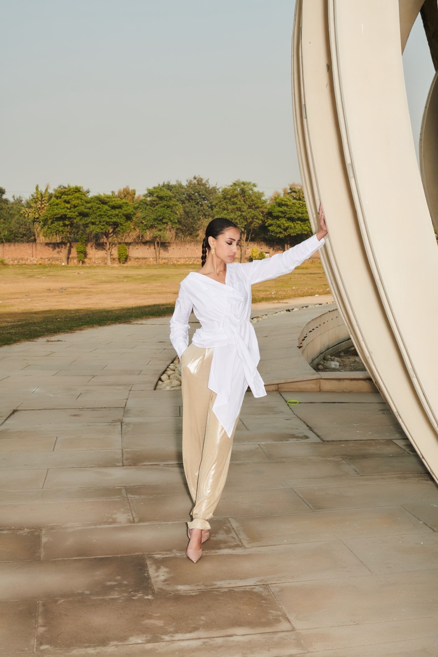 White Asymmetrical Draped Top With Golden Straight Pants