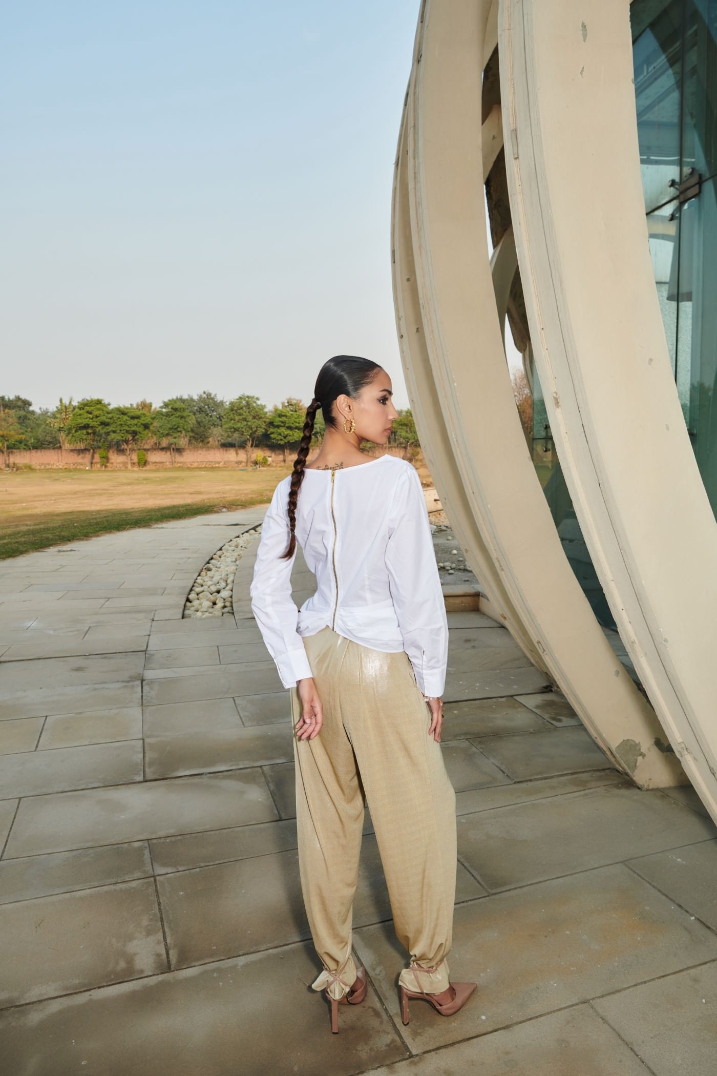 White Asymmetrical Draped Top With Golden Straight Pants