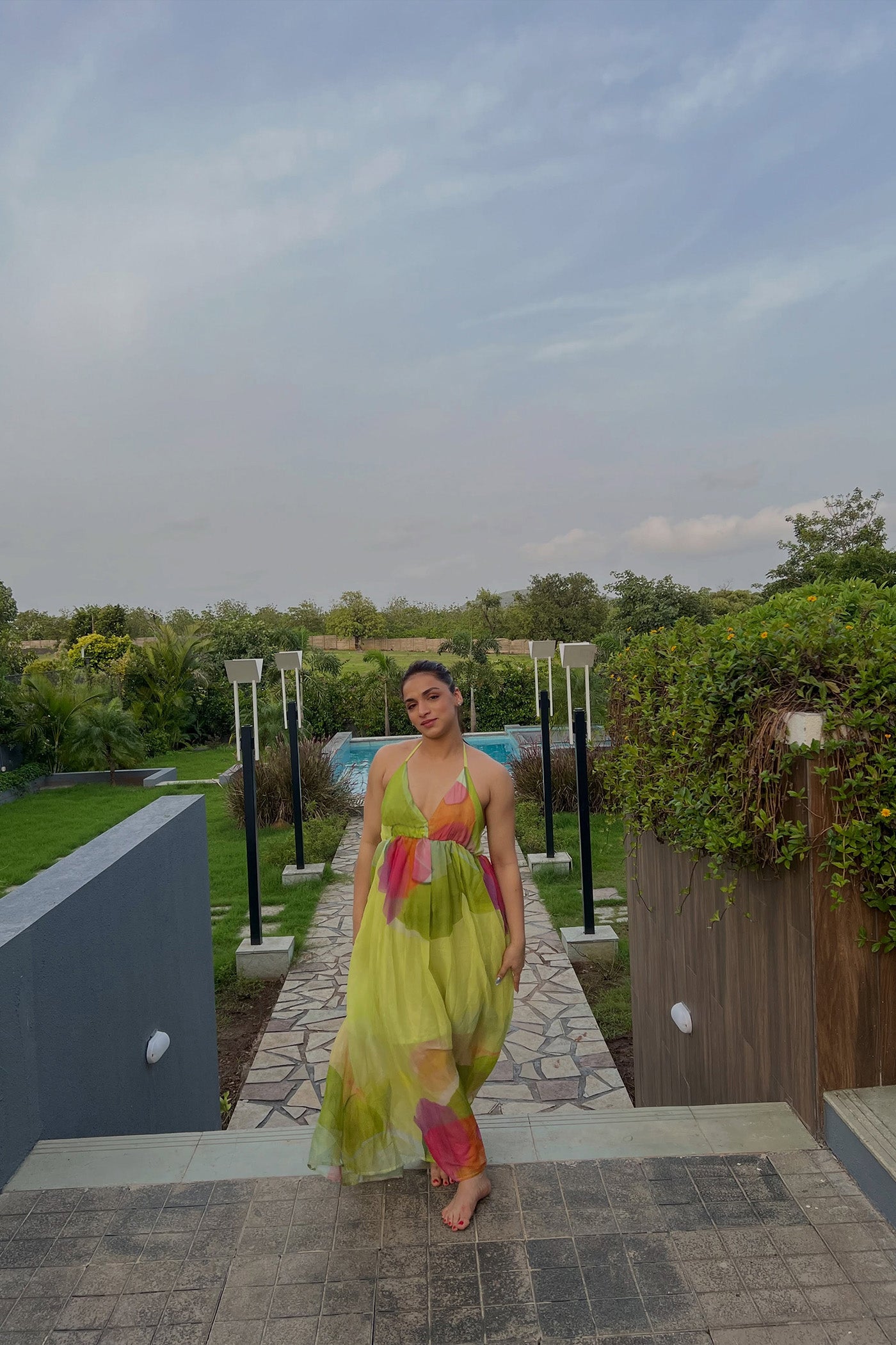 SHIVANI JHA In Green Printed Backless Halter Neck Maxi Dress
