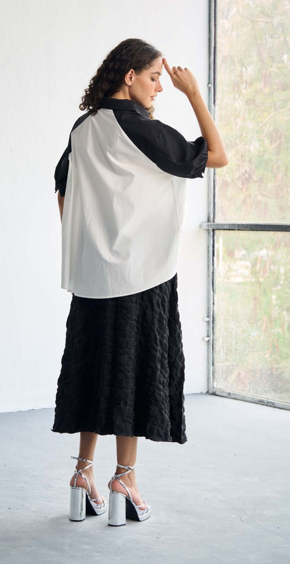 Monochrome Chic High-Low Tucked Top